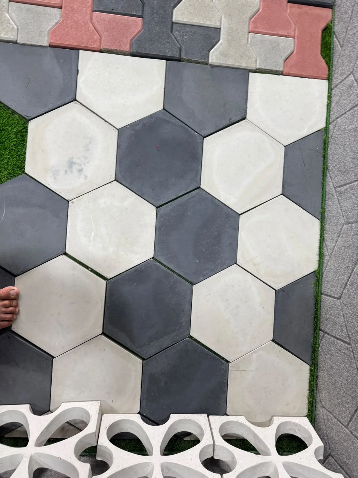 Hexagonal black and ivory concrete tile pattern